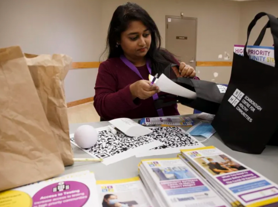 One of the community vaccine ambassadors, Shreya, assembling an SCHC outreach kit.